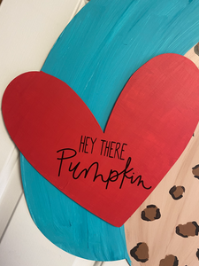 Up close picture of deep-V heart that is magnetek to the bumpy pumpkin.  Vinyl saying on deep-V heart is Hey there Pumpkin